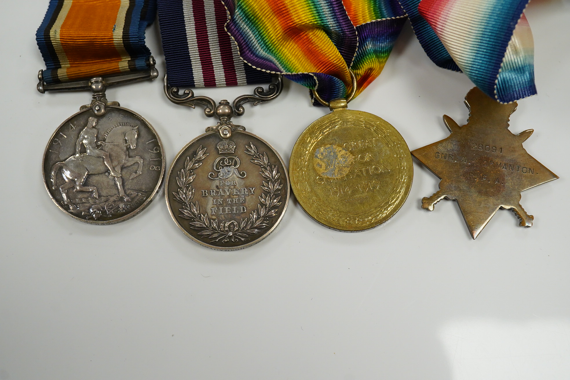 A First World War M.M. medal group awarded to CPL. A. Normanton 168/BDE:R.F.A. comprising of a WWI trio and a Military Medal for bravery in the field. Condition - fair to good